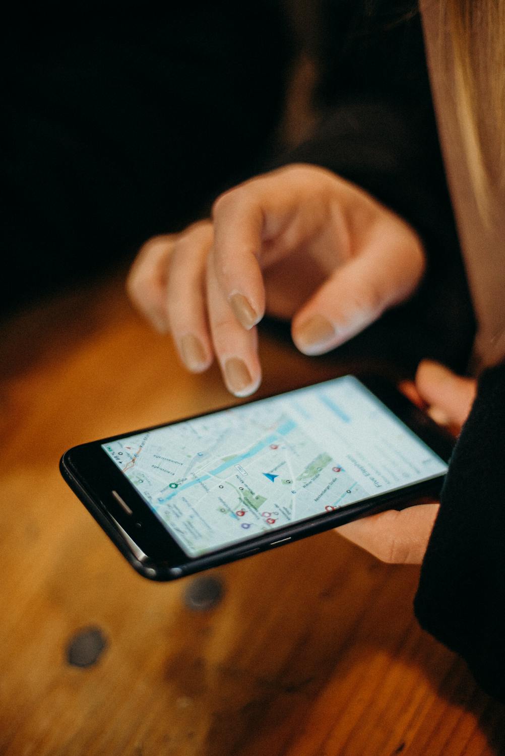 Customer using smartphone map to find a local business through Google Maps